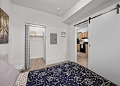 Thumbnail 13 of 31 - A bedroom with a sliding door at Majestic Drive, Missoula Montana