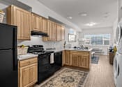 Thumbnail 8 of 31 - A kitchen with wooden cabinets at Majestic Drive, Montana, 59808