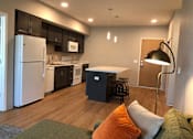 Thumbnail 4 of 33 - Affordable 1-3 bedroom apartment interior at Morrow Apartments in St. Paul, MN featuring a modern kitchen island