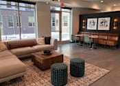 Thumbnail 15 of 33 - Modern resident lounge at Morrow Apartments in St. Paul, MN, near the Green Line and Midway Marketplace.