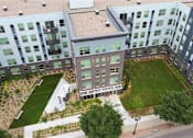 Thumbnail 26 of 33 - Community courtyard and green space at Morrow Apartments, offering affordable 1-3 bedroom rentals in St. Paul.