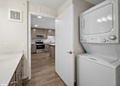 Thumbnail 12 of 40 - A white oven is in a kitchen with a white counter.