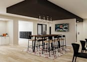 Thumbnail 36 of 40 - A modern living room with a bar area and a view of the outdoors.