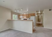 Thumbnail 23 of 48 - Kitchen with appliances and cabinets at River Walk Apartments, Boise, Idaho