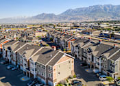 Thumbnail 25 of 26 - A row of houses with a mountain in the background at The Alloy at Geneva, Vineyard, 84058