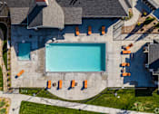 Thumbnail 20 of 26 - An aerial view of a swimming pool surrounded by orange lounge chairs at The Alloy at Geneva, Vineyard, 84058