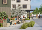 Thumbnail 6 of 10 - A group of people are sitting on a bench outside a building.