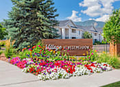 Thumbnail 1 of 37 - A sign that says Village at Westmeadow in front of some houses.