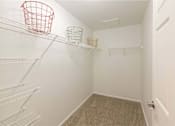 Thumbnail 36 of 37 - Empty white pantry with shelves and baskets.