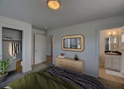 Thumbnail 2 of 41 - A bedroom with a bed, dresser, mirror, and closet at Four Points, Montana