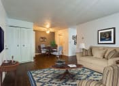 Thumbnail 32 of 44 - Living Room With Kitchen View at Highland Club Apartments, Watervliet, NY 12189