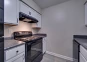 Thumbnail 3 of 44 - Kitchen with White Cabinets at Highland Club Apartments, Watervliet, NY 12189