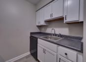 Thumbnail 17 of 44 - Kitchen with White Cabinets at Highland Club Apartments, Watervliet, NY 12189