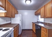 Thumbnail 14 of 44 - Updated Kitchen with Marbled Brown Countertops at Highland Cub Apartments, Watervliet, NY 12189