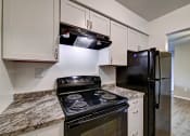 Thumbnail 15 of 44 - Updated Kitchen With Black Appliances at Highland Club Apartments, Watervliet, NY 12189