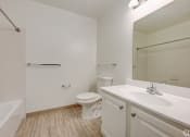 Thumbnail 7 of 41 - a bathroom with a sink toilet and shower and a bath tub at Boulder Pointe Apartments in Middletown, NY 10940