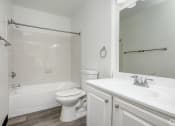 Thumbnail 9 of 41 - a bathroom with a sink toilet and a bath tub at Boulder Pointe Apartments in Middletown, NY 10940
