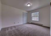 Thumbnail 31 of 45 - Bedroom with accessible closet and window at Cedar Park Apartments, Troy, NY, 12180