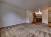 Thumbnail 29 of 45 - Living room and kitchen with carpeting at Cedar Park Apartments, Troy, NY, 12180