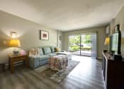 Thumbnail 22 of 45 - Lliving room has a large sliding glass door to the patio at Cedar Park Apartments, Troy, 12180