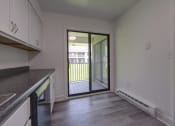Thumbnail 8 of 47 - an empty kitchen with a door to a balcony