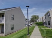 Thumbnail 42 of 47 - a lamp post in the middle of a sidewalk in front of houses