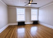 Thumbnail 10 of 27 - Room with ceiling fan at Willett Apartments, Albany, NY