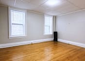 Thumbnail 13 of 27 - Room with wooden floor and windows at Willett Apartments, Albany, New York