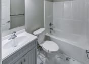 Thumbnail 6 of 33 - a white bathroom with a sink toilet and shower