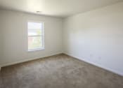 Thumbnail 12 of 33 - an empty room with carpet and a window