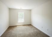 Thumbnail 11 of 33 - an empty room with carpet and a window