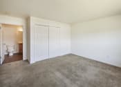 Thumbnail 10 of 33 - a room with carpet and a toilet in it