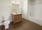 Thumbnail 8 of 33 - a bathroom with a toilet and a sink and a shower