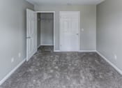 Thumbnail 17 of 33 - a room with a carpeted floor and a closet