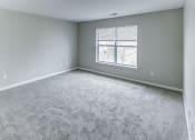Thumbnail 15 of 33 - an empty room with carpet and a window