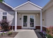 Thumbnail 20 of 30 - a house with a white door and a walkway in front of it