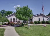 Thumbnail 19 of 30 - a house with an american flag in front of it