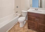Thumbnail 9 of 30 - a bathroom with a toilet sink and bathtub