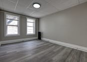 Thumbnail 18 of 27 - A room with a speaker on the floor.