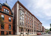 Thumbnail 2 of 27 - Row of red brick buildings at Willett Apartments, New York