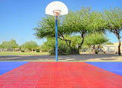 Thumbnail 3 of 11 - a basketball hoop on a blue pole in a park