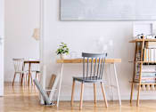 Thumbnail 17 of 20 - A room with a table, chairs and a plant.