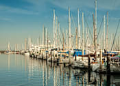 Thumbnail 26 of 30 - A marina filled with lots of boats.