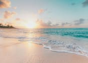 Thumbnail 3 of 5 - A serene beach scene with the sun setting over the ocean.