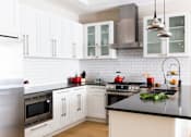 Thumbnail 4 of 13 - Modern kitchen with stainless steel appliances