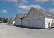 Thumbnail 4 of 8 - a row of white garages in front of a parking lot