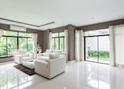 Thumbnail 4 of 14 - a living room with white furniture and large windows
