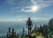 Thumbnail 5 of 5 - a person standing on top of a mountain