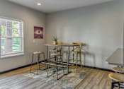 Thumbnail 9 of 16 - a dining area with a table and chairs and a window