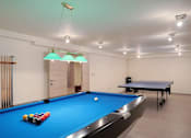 Thumbnail 1 of 6 - a game room with a pool table and